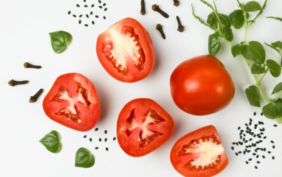 red tomato on white surface